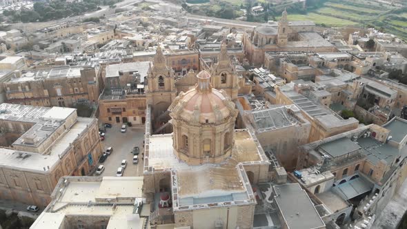 Circling around St Paul's Cathedral in the stone fortified walled city of Mdina, Malta