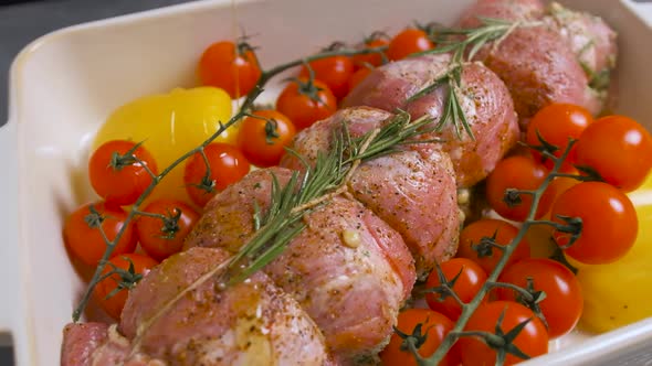 The Chef Pours Oil Over a Piece of Meat with Vegetables, Prepares the Food.