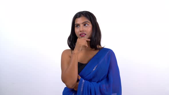Disappointed Indian woman thinking in saree