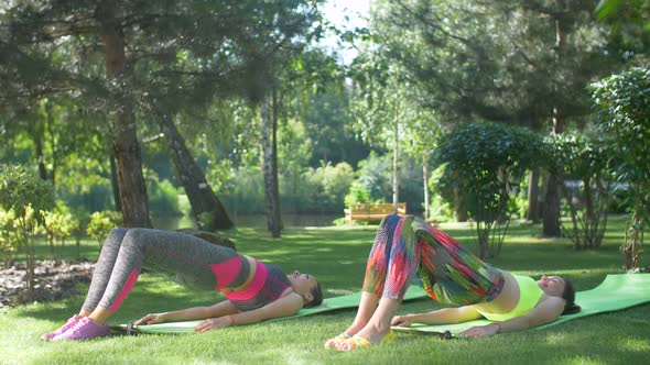 Fitness Females Doing Half Bridge Pose Yoga Exercise