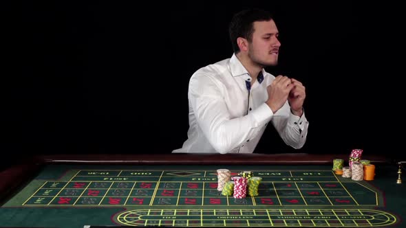 Guy Bets in the Casino and Loses, Black, Slow Motion