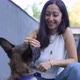 Woman Plays with a Cute Puppy on Her Lap - VideoHive Item for Sale