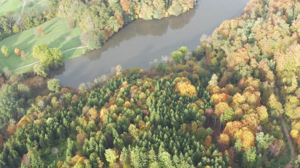 Aerial Above Lake with Autumn Foliage and Tree Reflections in Styria Thal Austria