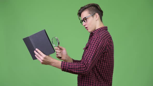 Young Handsome Teenage Nerd Boy Studying