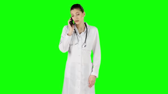 Female Doctor Talking on Mobile Phone. Green Screen