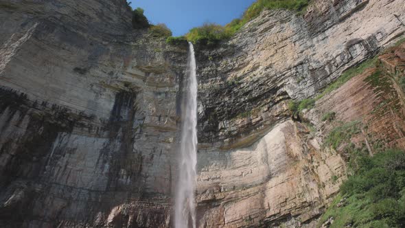 High waterfall between the rocks