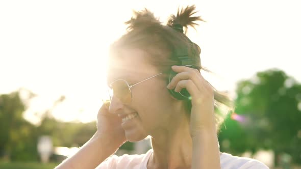 Close Up of Fair Hair Girl Dancing to the Rhythm of Music with Headphones