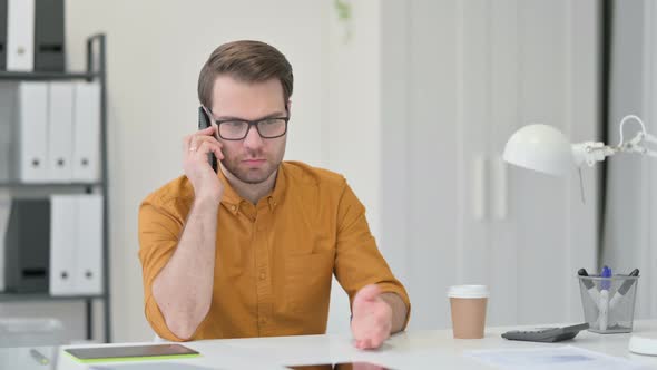 Young Man Talking on Smartphone 