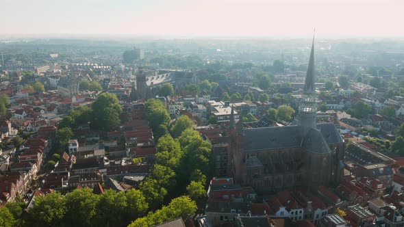 Neo-Gothic Basilica Of Gouwekerk And Distant View Of Sint-Jan Church In The Heart Of Gouda Municipal