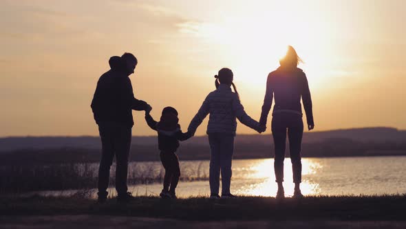 Silhouette of Family at the Coast