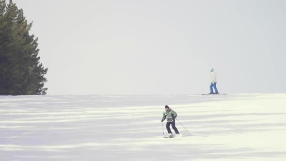 Tourists Relax at the Mountains Ski Resort