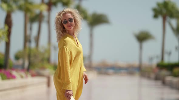 Summer Vacation in Tropical Country Woman is Walking Outdoors