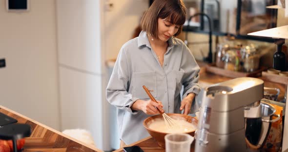 Woman Baking Waffles at Home