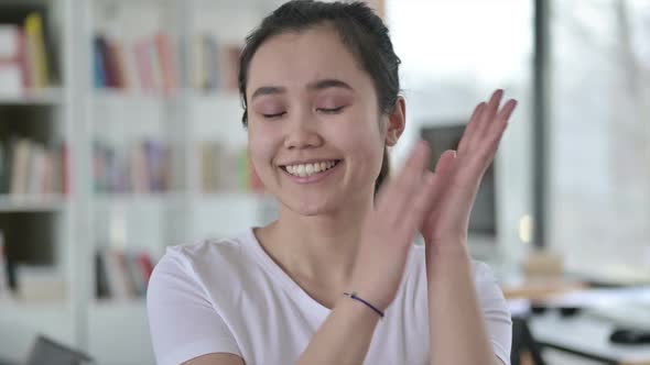 Portrait of Beautiful Young Asian Woman Clapping Cheering