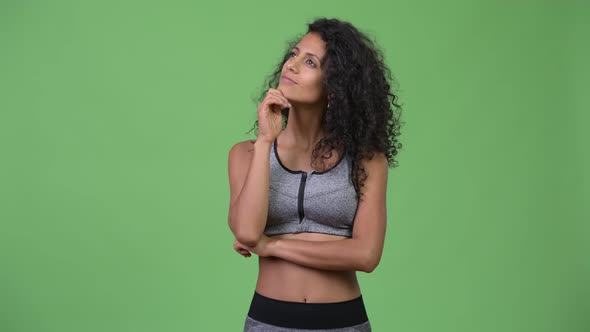 Young Beautiful Hispanic Woman Thinking Ready for Gym