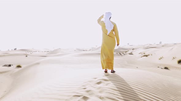 Man walking in the Dubai desert