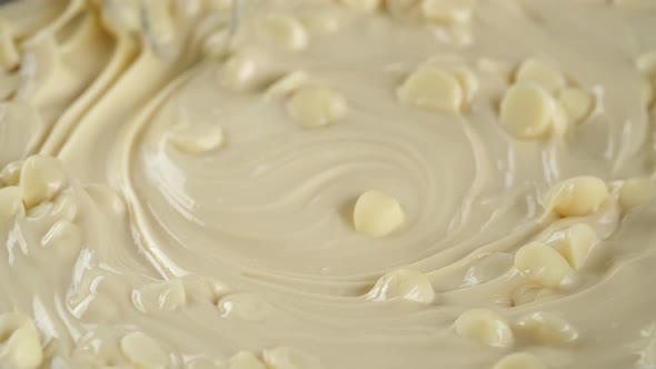 Process melt white chocolate. Stir chocolate chips and liquid white chocolate.