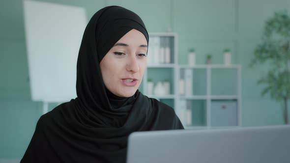 Emotional Indian Business Woman Wears Black Hijab Waving Hello Communicates with Distance Internet