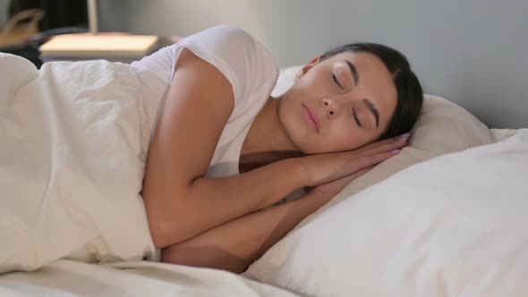 Peaceful Young Latin Woman Sleeping in Bed