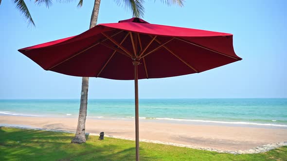 Beautiful tropical sea beach around with umbrella chair on blue sky