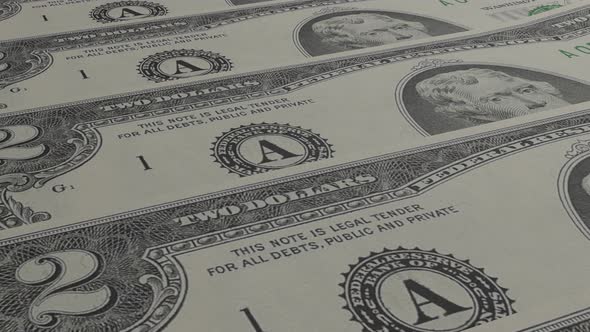 2 dollar bills background. Many banknotes.