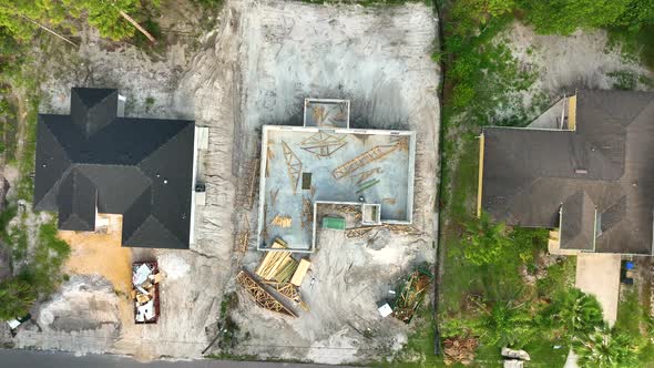 Aerial View of Incompleted Frame of Private Home Under Construction with Brick Concrete Walls Ready alt