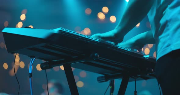 Close Up View of Musician Hand Playing Synthesizer Piano on Live Concert at Stage