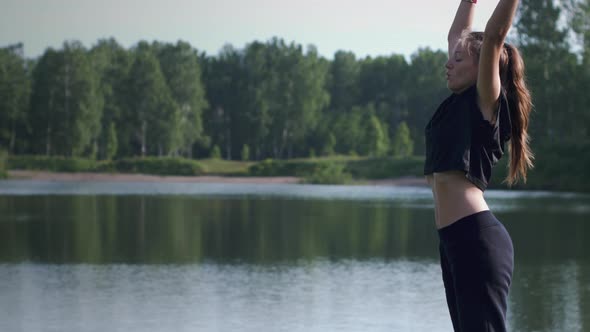 Girl practices breathing exercises outdoor