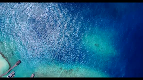 Aerial texture of tropical seashore beach vacation by blue green sea and white sand background of ad