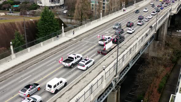 Waving Canadian Flags During The Convoy Truckers Protest 2022 At Burrard Bridge In Vancouver, Canada