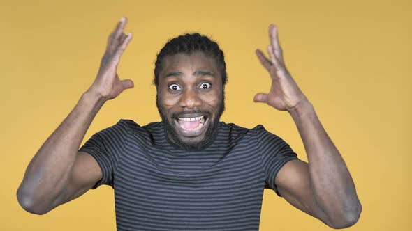 Screaming Angry Casual African Man Isolated on Yellow Background