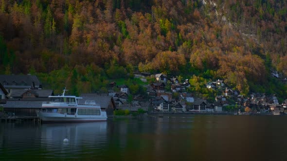 Autumn Fall in Famous Tourist Destination Serene Town Hallstatt in Mountains Alps. Yacht, Cathedral