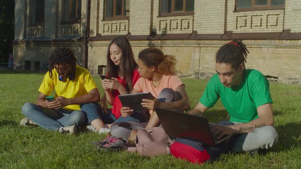 Multiethnic Students Studying with Digital Devices