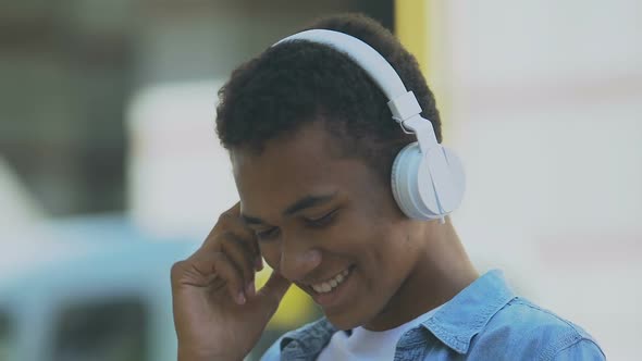 African-American male teenager in headphones