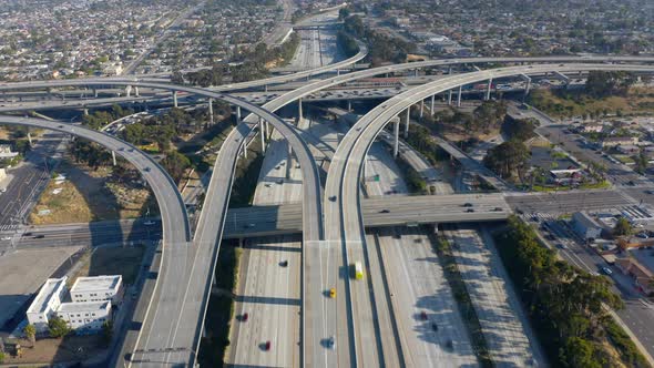 Topdown View Over a Roadbed of Los Angeles Freeway Filled with Moving Cars