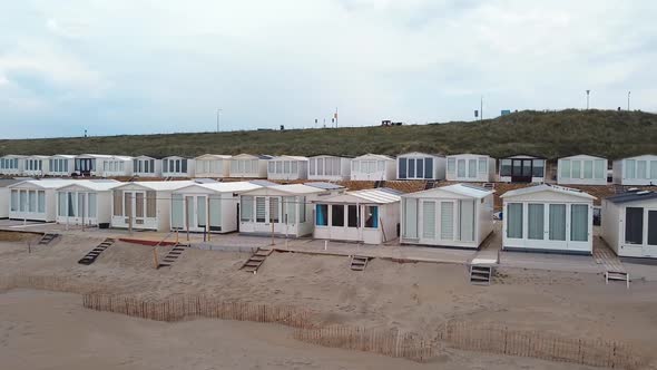 Long line of cabins on North sea beach.