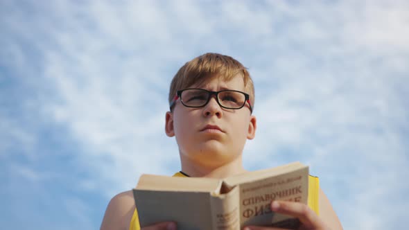Young boy with a book, slow motion