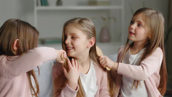 Three Funny Cute Little Girls Sisters Best Friends Triplets Twins Same Children Sitting at Home