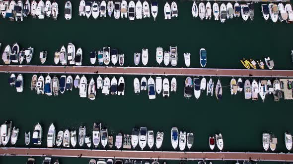 Multiple Small Boats Docked in Harbor