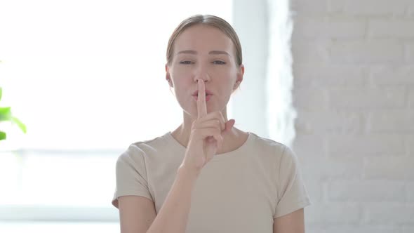 Woman Asking for Silence With Fingers on Lips Quiet Please