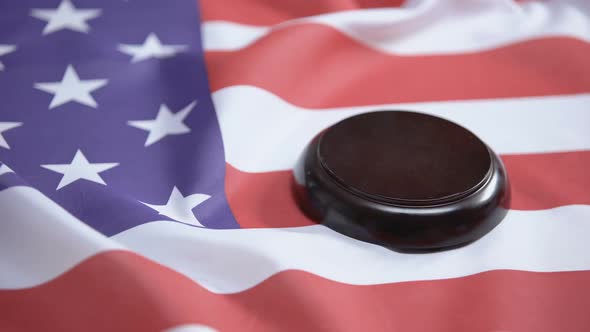 Gavel Striking on Sound Block Against American Flag, Case Law, Court System