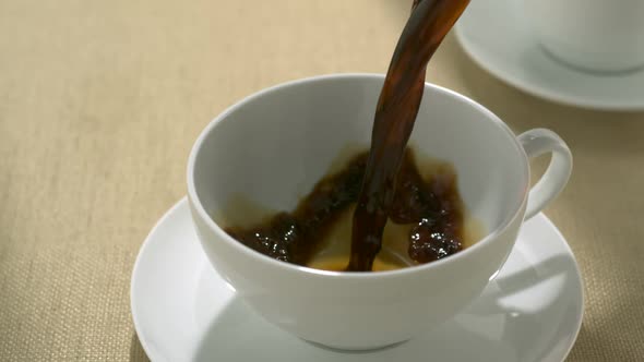 Pouring coffee into cup, Slow Motion