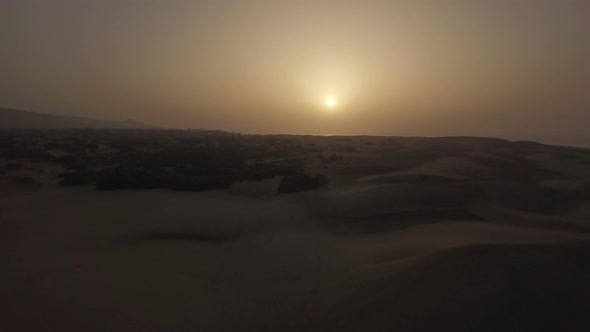 Aerial scene of sand dunes at sunset