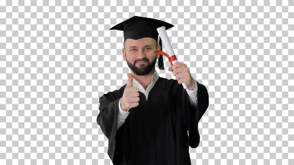 Young male smiling graduate showing thumb up, Alpha Channel