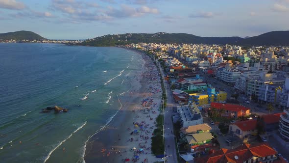 Aerial dolly out shot revealing Bombas beach, a popular destination in Brazil