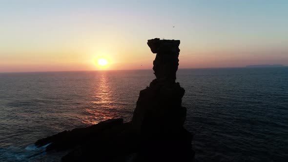 Rock Formation in the Sea at Sunset