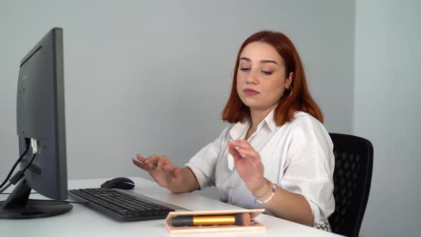 Woman Doing Makeup Working on Computer in Office 4K