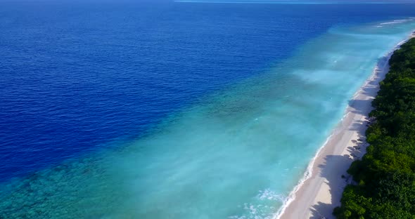 Beautiful above copy space shot of a summer white paradise sand beach and aqua blue water background