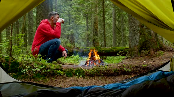 Bearded Man By the Fire in a Beautiful Forest