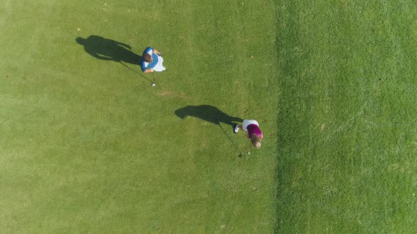 Green Park Man Trainer Teaches Woman to Play Golf Woman Hits the Ball Golf Course in Forest Area